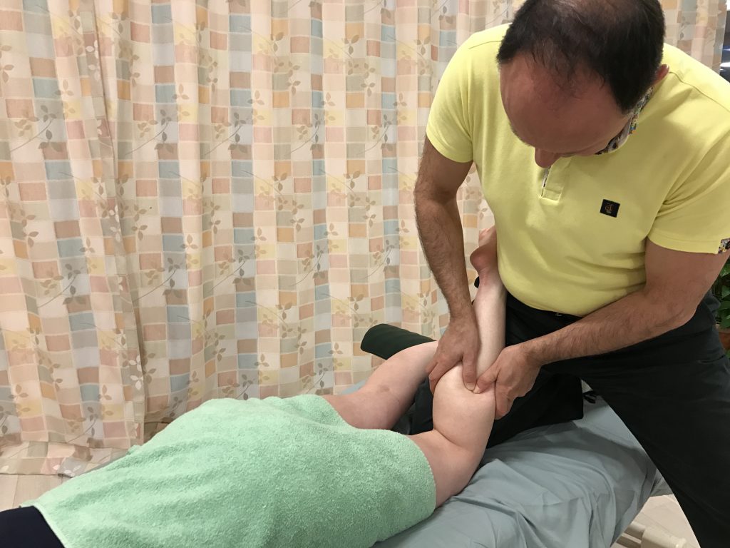 Massage therapy to the posterior leg - with the knee joint flexed to allow better access to the soleus
