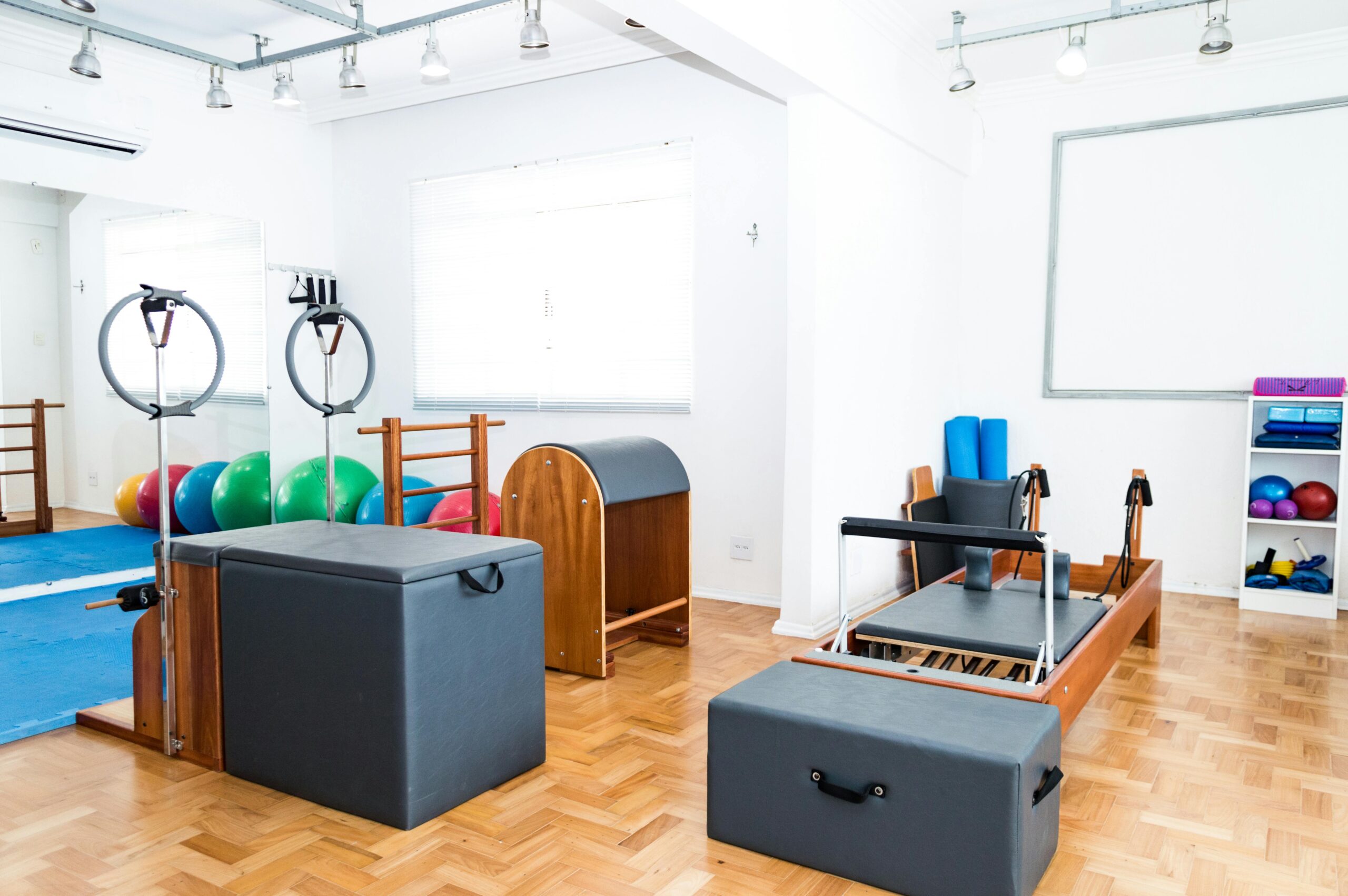 A Pilates studio with professional exercise equipment including spine correctors