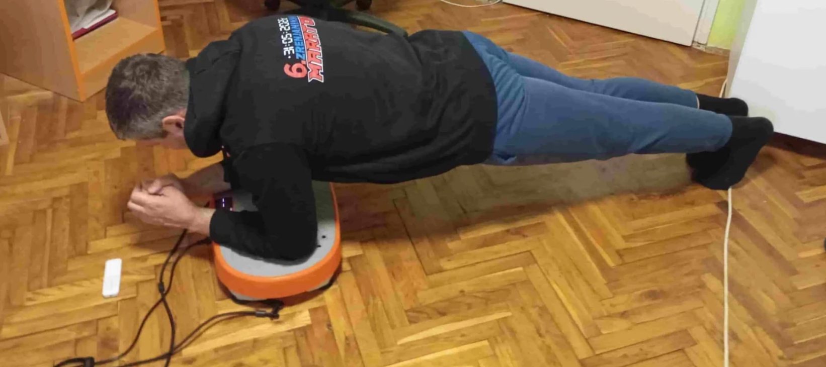 Vladimir Stanar on a vibration plate doing elbow plank